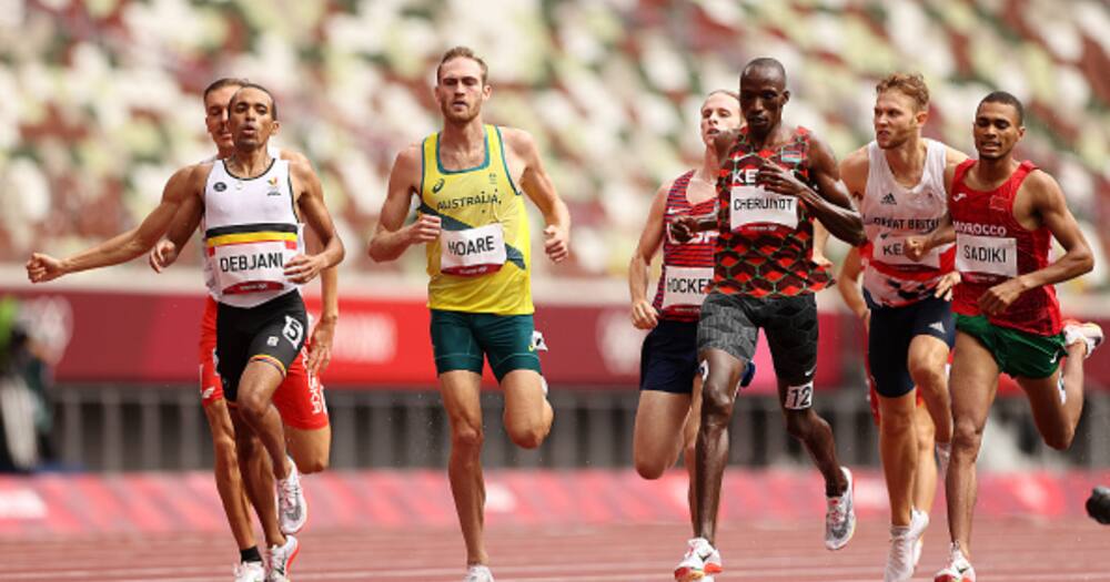 Ismael Debjani of Team Belgium, Timothy Cheruiyot of Team Kenya and Abdelatif Sadiki of Team Morocco compete in round one of the Men's 1500m heats. (Photo by David Ramos/Getty Images)