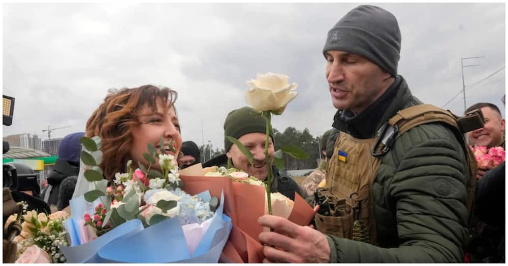 Ukrainian couple exchange vows in battle frontline.