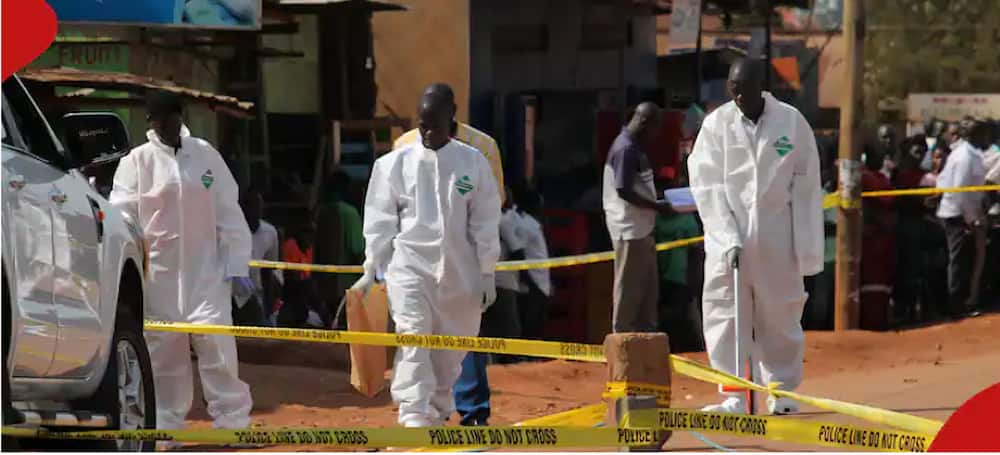 Men dressed in PPE's at a crime scene