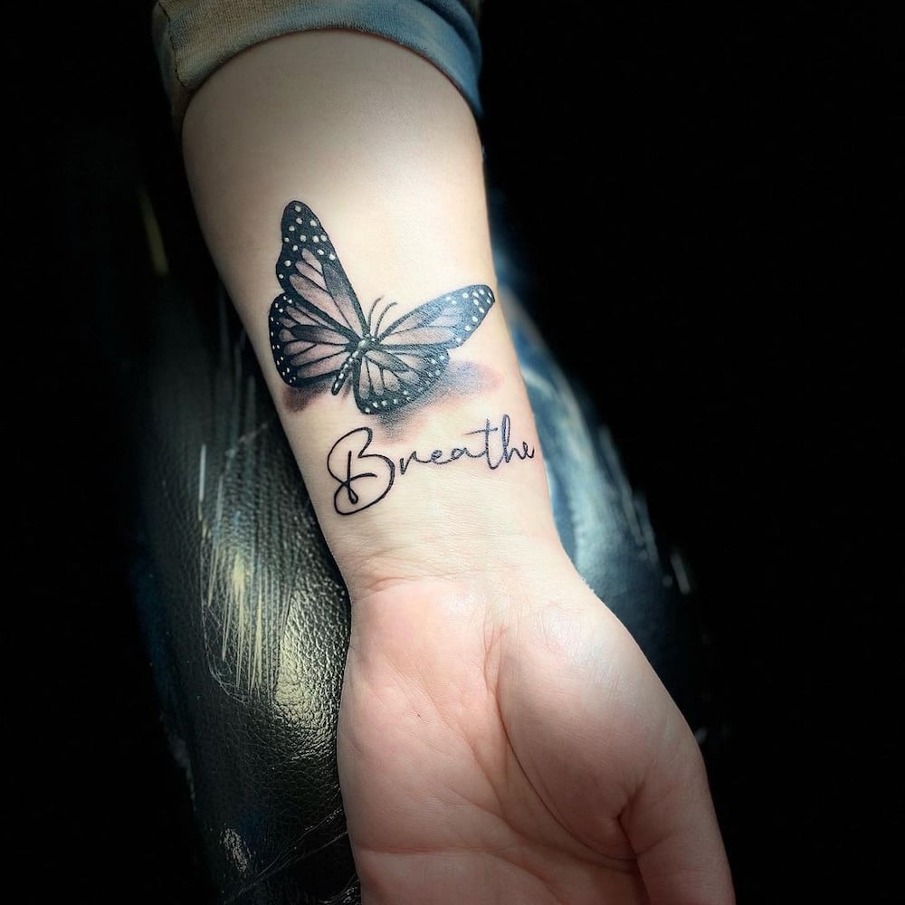 butterfly tattoos on wrist with name