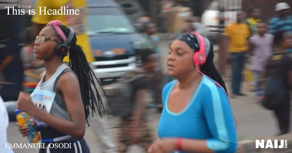 Two female athletes have their headphones and look focus for the ultimate prize