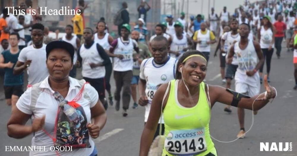 A female athlete listening to music in excitement.