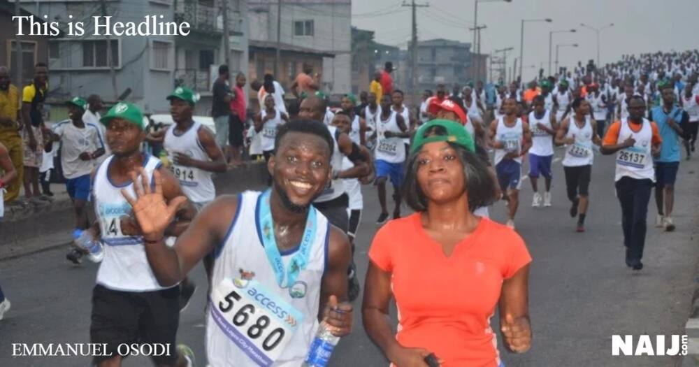 An athlete smile for the camera with his bottle of water.