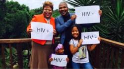 Photo of the family with placards displaying their HIV status is going viral